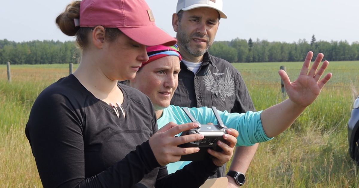 Sonja Jarrett, middle, is filming her movie on location with two crew members.